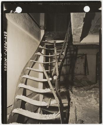 [Steel stairs warped by intense heat from burned book stacks of Asano Library, Hiroshima], November 15, 1945.